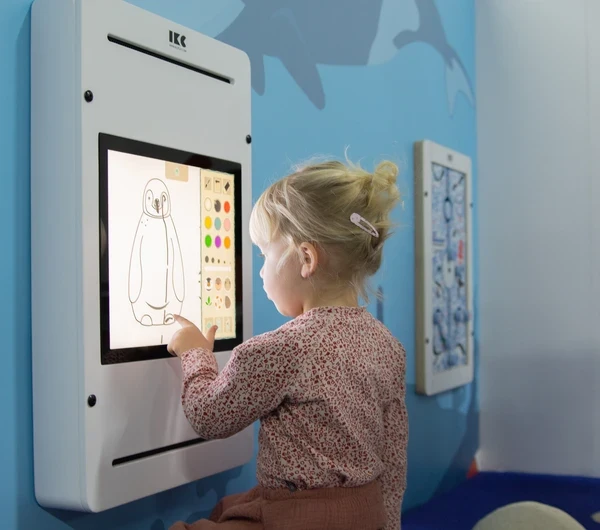 Girl playing with interative wall 