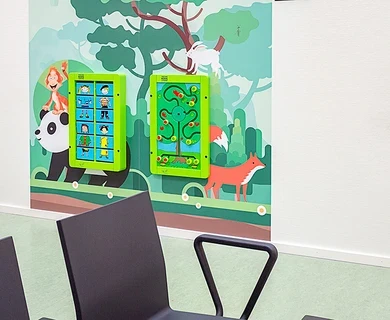 this image shows a kids corner with wall games in a hospital